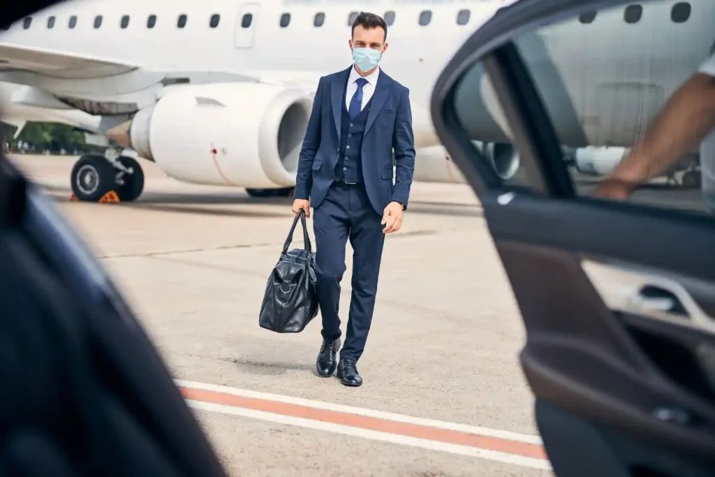 Luxury chauffeur-driven airport transfer car arriving at airport for Woking travel service