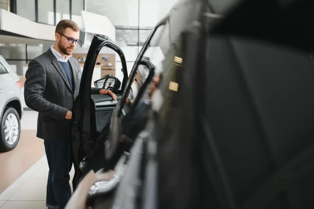 Luxury chauffeur-driven airport transfer car arriving at airport terminal in Farnborough