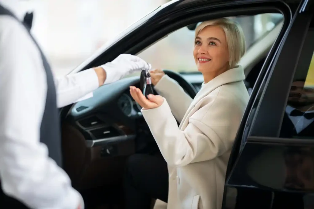 Elegant wedding arrival in luxury chauffeur-driven car at wedding venue in Farnborough